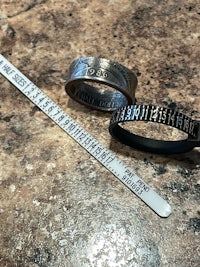 two rings with a ruler next to them