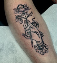a tattoo of a hand with a flower on it