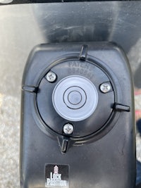 a close up of a black gas tank on a truck