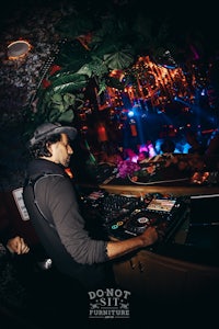 a dj at a nightclub playing music
