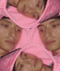 a picture of a man in a pink hoodie