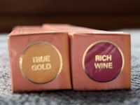two boxes with the words rich time gold wine on them