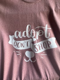 a pink t - shirt with the words don't shop on it