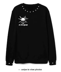 a black sweatshirt with studs on it