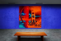 a painting of a golden gate bridge on a blue wall