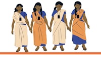 a group of women in saris standing together