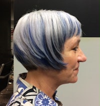 a woman with a blue and white bob haircut