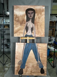 a painting of a woman on a easel