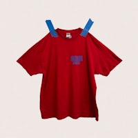 a red t - shirt hanging on a hanger