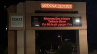 the entrance to the avenna center at night