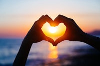 hands making a heart shape at sunset - love stock pictures, royalty-free photos & images