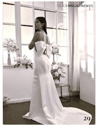 a black and white photo of a woman in a wedding dress