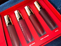 four lipsticks in a red box