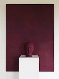 a white pedestal with a sculpture on it