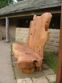 a bench made out of a tree stump