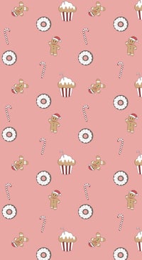 gingerbread cookies and candies on a pink background