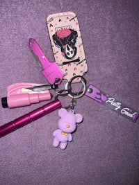 a pink key chain with a pink key ring