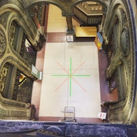 a view of an ornate building with green lines on the floor