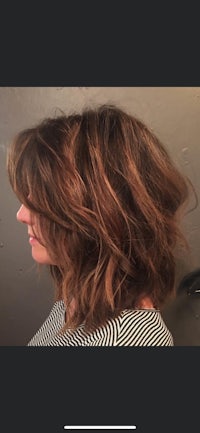 the back of a woman's hair with a wavy bob