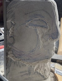 a clay sculpture with a drawing on it