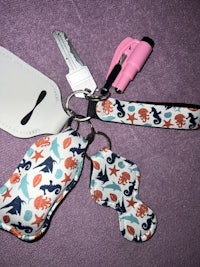 a key chain with a key ring and a key fob