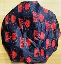 a black and red bike cover with a red logo on it