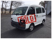 a white van with a sold sign on it