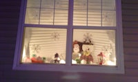 a window with a snowman in it