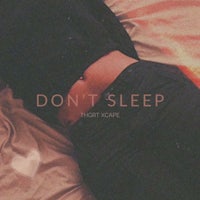 a woman laying on a bed with the words don't sleep