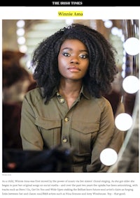 a photo of a woman with afro hair in front of a mirror