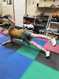 a man doing an exercise in a gym