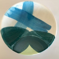 a bowl with a blue and green design on it