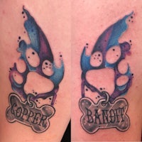 a tattoo of a dog's paw and a dog's name