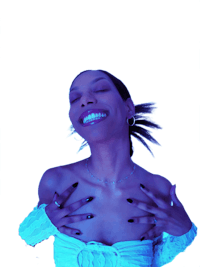 a woman is holding her hands up in a blue light