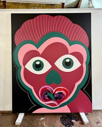 a painting with a pink face on it