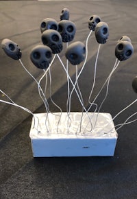 black skulls on a table with wires