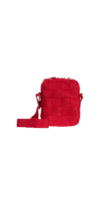 a red cross body bag on a black background