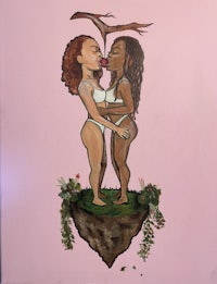 a painting of two women kissing on a pink wall