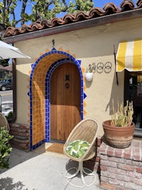 a doorway with a blue and yellow tiled door