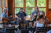 a group of people playing music in a restaurant