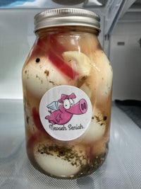 a jar of pickled eggs with a label on it