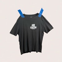 a black t - shirt with blue tape on it