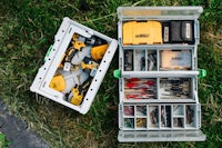 a tool box with tools on the grass
