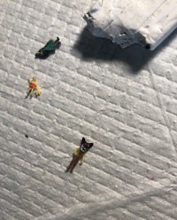 a pile of small toys on top of a piece of paper