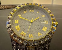 a gold and diamond watch with roman numerals