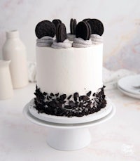 a white cake with oreo cookies on top