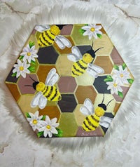 bees and daisies painted on an octagon