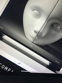 a black and white photo of a face on a computer screen