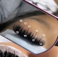 a woman's eyelashes are shown in a mirror