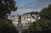 a view of san francisco from the top of a hill